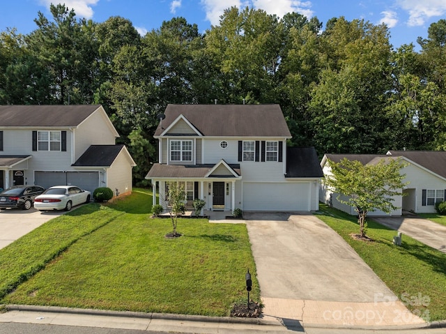 view of front of home with a porch, a garage, and a front yard