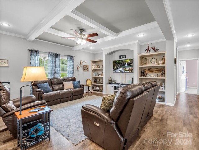 living room featuring beamed ceiling, ceiling fan, and light hardwood / wood-style floors