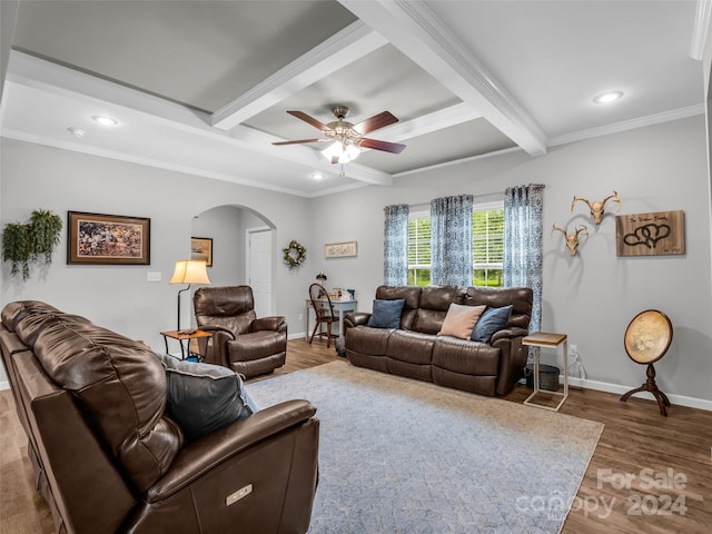 living room featuring hardwood / wood-style flooring, ceiling fan, beam ceiling, and crown molding