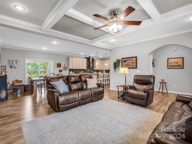 living room with beam ceiling and light hardwood / wood-style floors