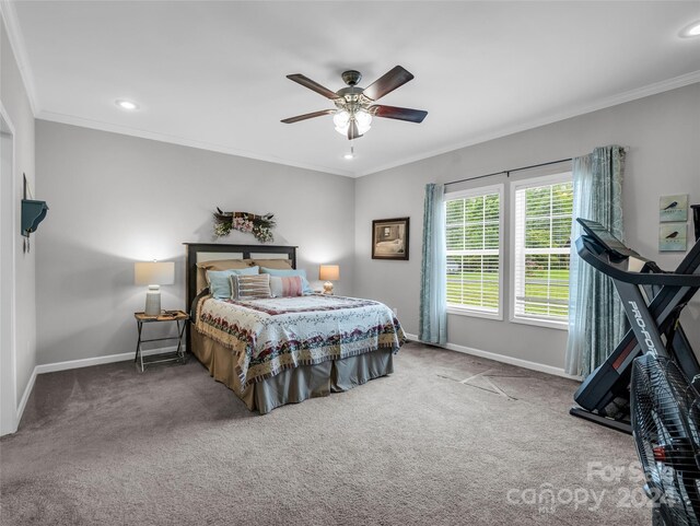 bedroom featuring carpet, ornamental molding, and ceiling fan