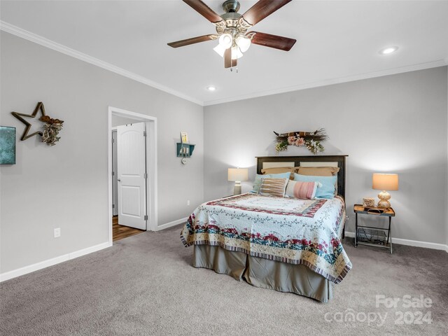 bedroom featuring ceiling fan, carpet flooring, and ornamental molding