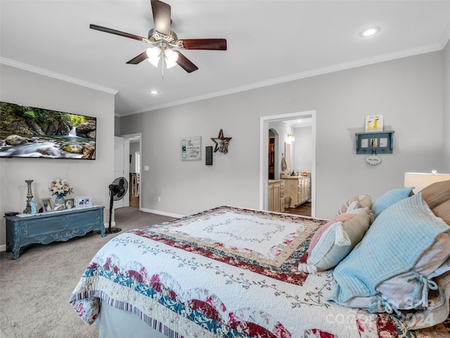 bedroom with ornamental molding, carpet floors, ceiling fan, and ensuite bath