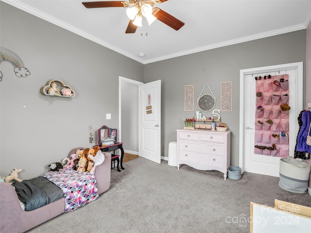 bedroom with ornamental molding, carpet flooring, and ceiling fan