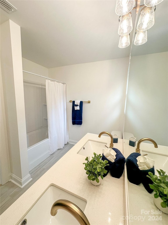 bathroom featuring shower / tub combo with curtain, wood-type flooring, and vanity