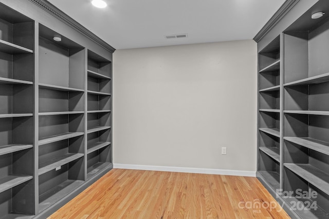 spacious closet featuring hardwood / wood-style flooring