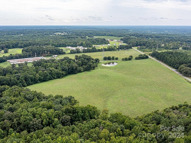 birds eye view of property with a rural view