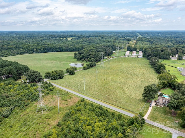 birds eye view of property with a rural view