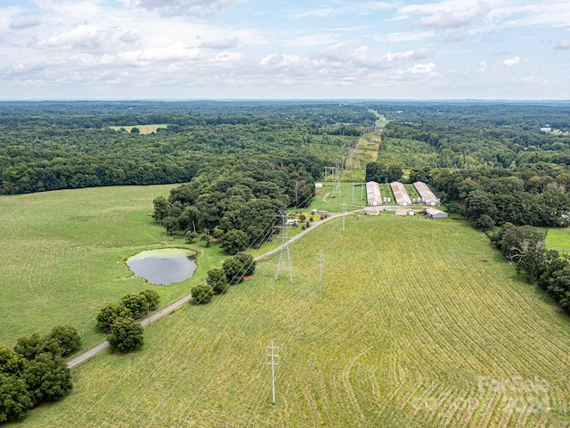 birds eye view of property featuring a rural view and a water view