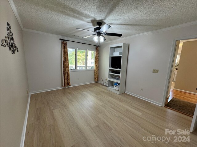 unfurnished bedroom with ceiling fan, crown molding, light hardwood / wood-style flooring, and a textured ceiling