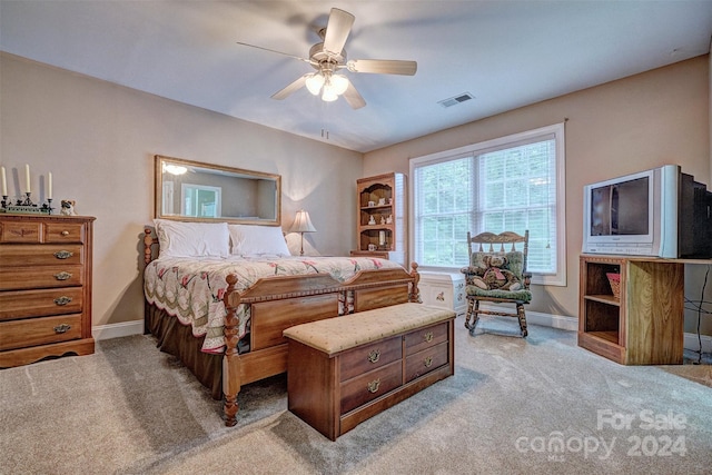 bedroom featuring ceiling fan and light carpet