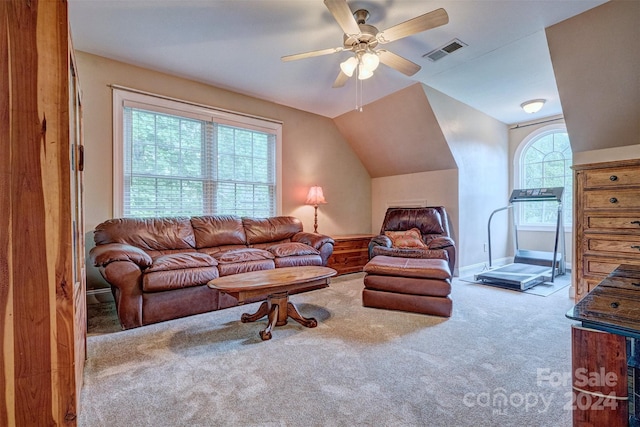 living room with lofted ceiling, light colored carpet, and ceiling fan