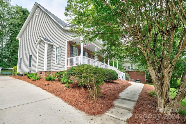 view of home's exterior featuring a porch