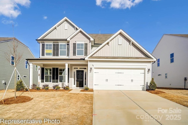 craftsman inspired home featuring a garage and a porch