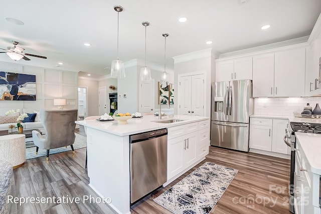 kitchen with white cabinetry, an island with sink, and appliances with stainless steel finishes