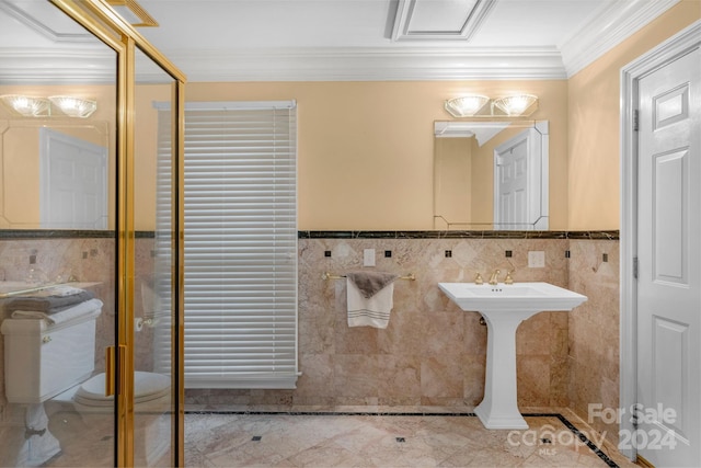 bathroom with crown molding and tile walls