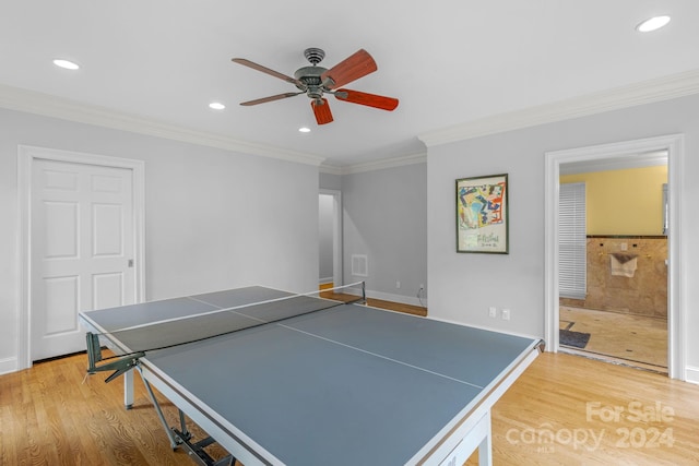 rec room featuring crown molding, hardwood / wood-style flooring, and ceiling fan