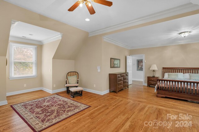 bedroom with ornamental molding, ceiling fan, and light hardwood / wood-style floors