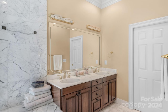 bathroom featuring ornamental molding and vanity