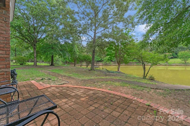 view of patio with a water view