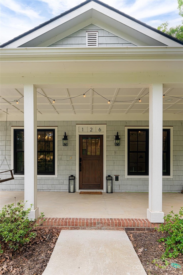 doorway to property with a porch