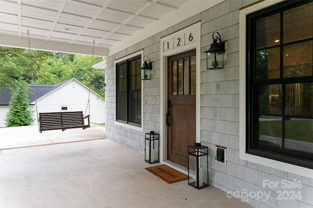 entrance to property with covered porch