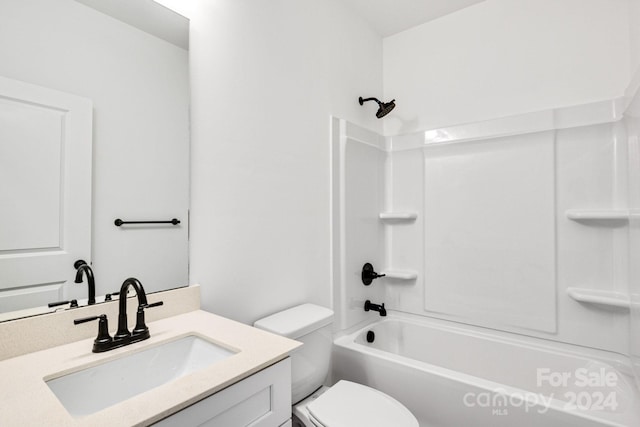 full bathroom featuring shower / washtub combination, toilet, and vanity