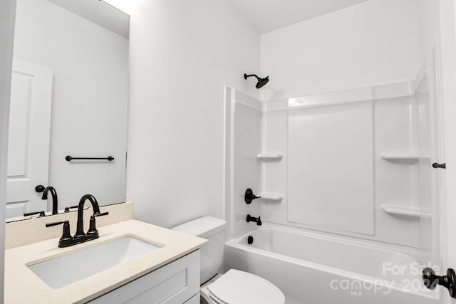 full bathroom with vanity, toilet, and  shower combination