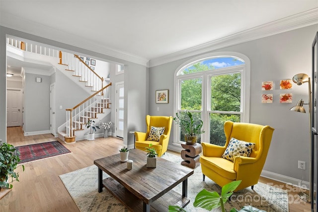 interior space with crown molding and light wood-type flooring