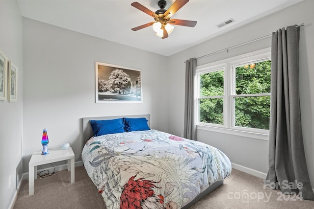 carpeted bedroom featuring ceiling fan