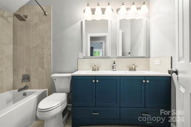 full bathroom featuring tiled shower / bath, decorative backsplash, dual vanity, toilet, and tile patterned flooring