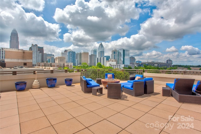 view of patio / terrace with an outdoor fire pit