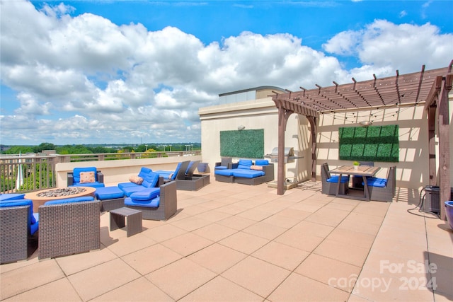 view of patio / terrace featuring a pergola and an outdoor living space with a fire pit