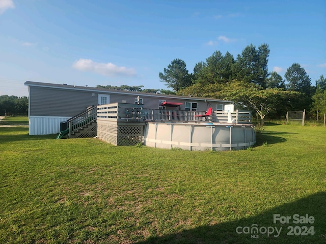 view of yard with a pool side deck