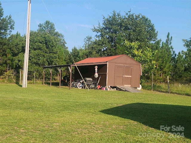 view of outbuilding with a yard