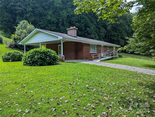 ranch-style home with a front yard