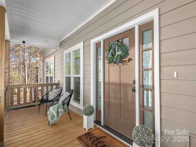 doorway to property with a porch