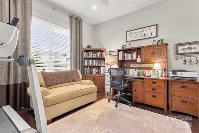 office space featuring ceiling fan and dark hardwood / wood-style flooring