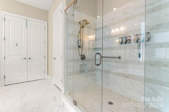 bathroom with a shower with shower door