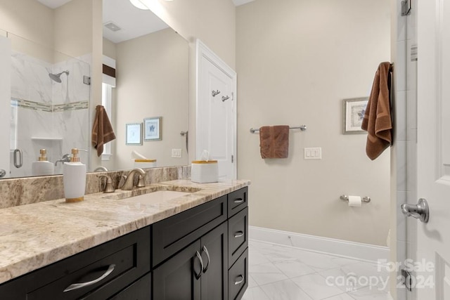 bathroom featuring vanity and a shower with shower door