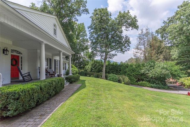 view of yard featuring a porch