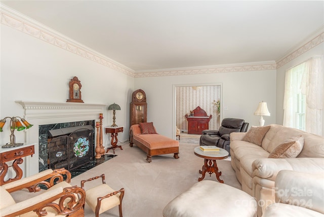 living room featuring a premium fireplace, carpet floors, and ornamental molding