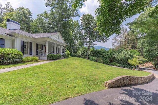 view of yard with covered porch