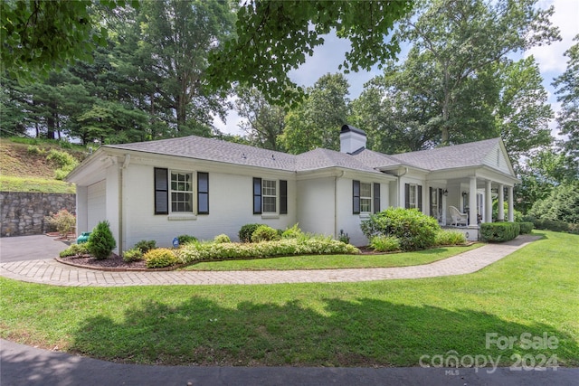 ranch-style house with a front lawn