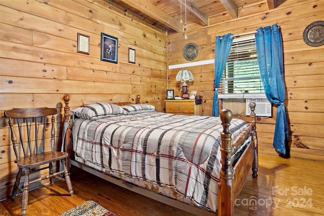 bedroom featuring wooden ceiling, beamed ceiling, wooden walls, and wood-type flooring