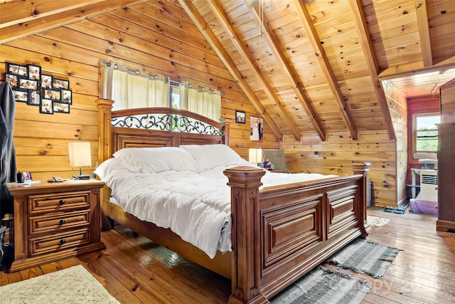 bedroom with wooden walls, wooden ceiling, vaulted ceiling with beams, and hardwood / wood-style floors