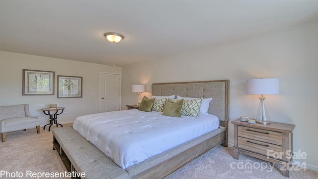 bedroom featuring light colored carpet