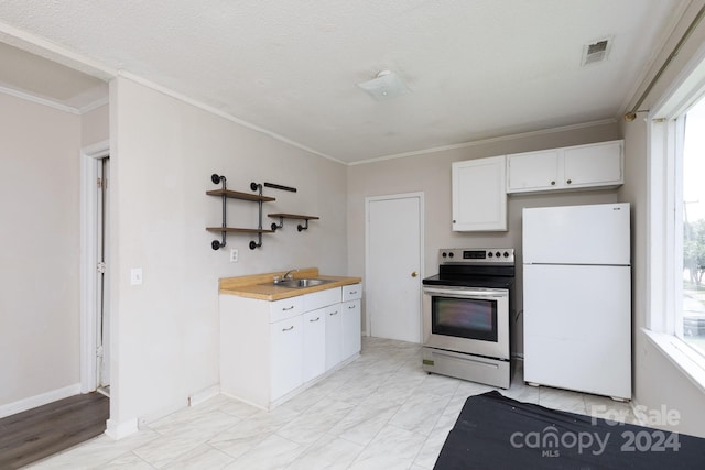 kitchen featuring wood counters, white cabinetry, sink, white refrigerator, and stainless steel electric range