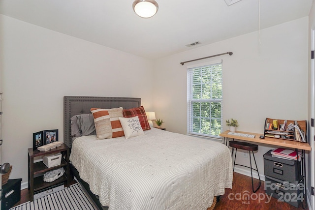 bedroom with wood-type flooring