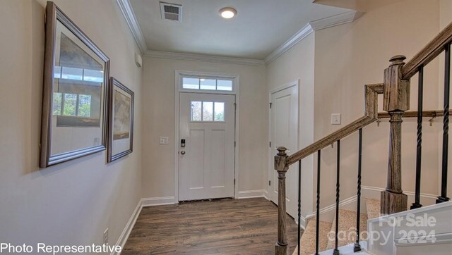 entrance foyer featuring wood-type flooring and ornamental molding